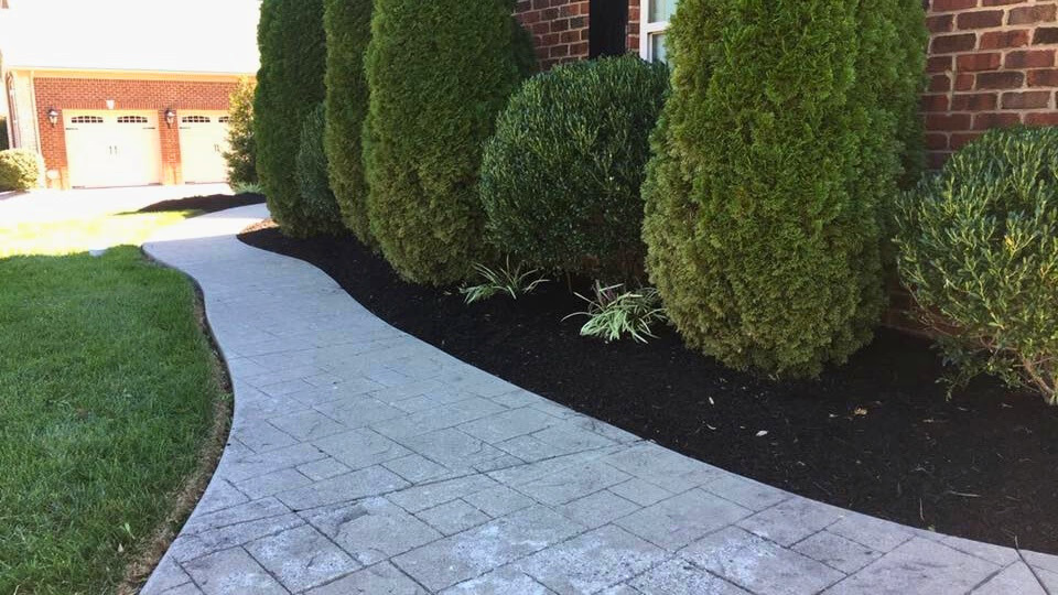 Lush green lawn maintained by Kirks Mowing & Landscape